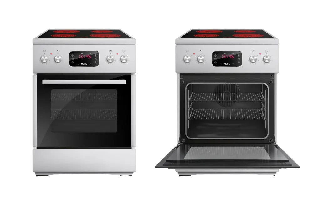 Técnico de mantenimiento reparando un horno en una cocina de Santander, utilizando herramientas profesionales para garantizar la seguridad y eficiencia del electrodoméstico.